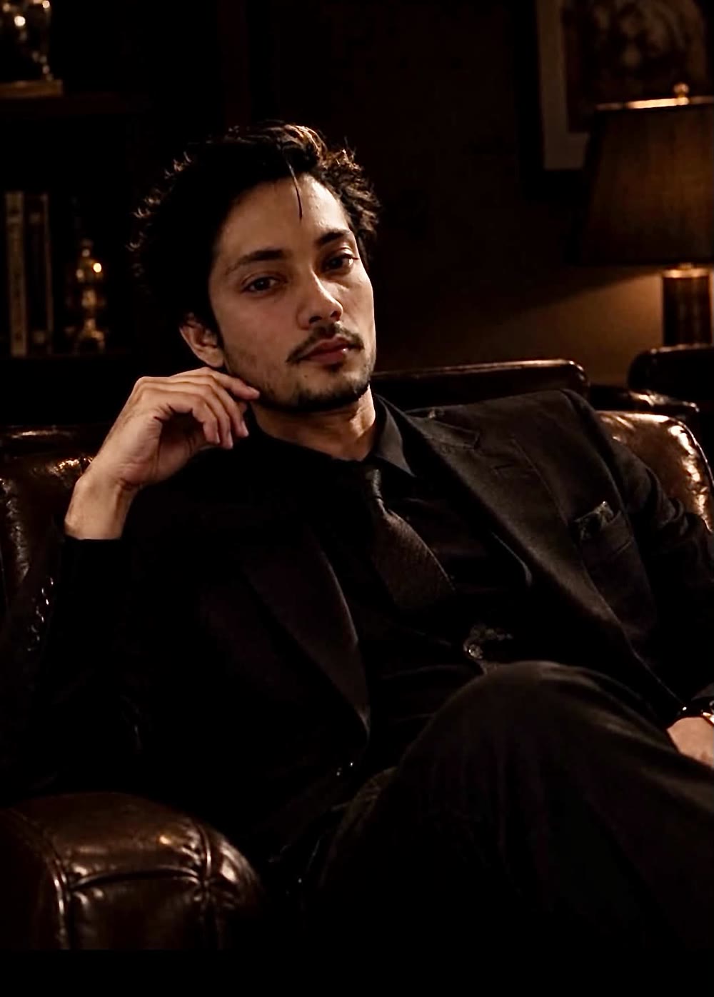 Nitesh Raut seated in a dark suit